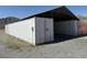 Outdoor storage with metal containers under a protective metal roof, ideal for secure storage at 4831 W Bell Vista Ave, Pahrump, NV 89060