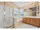 Bathroom featuring a walk-in shower, soaking tub and double sink vanity at 5 Spur Cross Cir, Henderson, NV 89012