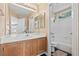 Well lit bathroom featuring a bathtub with tile surround, neutral walls, and wood vanity at 5 Spur Cross Cir, Henderson, NV 89012