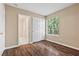 Bedroom with wood-look flooring, neutral paint and natural light at 5 Spur Cross Cir, Henderson, NV 89012