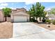 Charming home featuring a two-car garage, low-maintenance landscaping, and a concrete driveway at 5 Spur Cross Cir, Henderson, NV 89012
