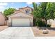Charming two-story home featuring a two-car garage and low maintenance landscaping at 5 Spur Cross Cir, Henderson, NV 89012