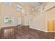Inviting living room with wood floors, a staircase, and large windows, perfect for entertaining at 5 Spur Cross Cir, Henderson, NV 89012