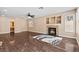 Open living room featuring wood flooring, fireplace, and ample space for relaxation and gatherings at 5 Spur Cross Cir, Henderson, NV 89012