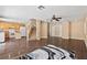 Living room showcases an open floor plan, seamlessly connects kitchen, staircase, and backyard access at 5 Spur Cross Cir, Henderson, NV 89012
