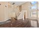 Spacious living room with wood floors, high ceilings, and staircase to the second floor at 5 Spur Cross Cir, Henderson, NV 89012