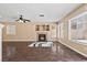 Bright and spacious living room featuring a cozy fireplace and large windows for natural light at 5 Spur Cross Cir, Henderson, NV 89012