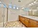 Bathroom featuring a double sink vanity, a glass shower, and tiled floors at 5709 Woodchester Ave, Las Vegas, NV 89139