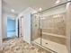 Bathroom with a glass shower, a tiled bench, and easy access to the bedroom at 5709 Woodchester Ave, Las Vegas, NV 89139