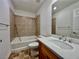 Bathroom with tile accents, a vanity with sink, mirror, and a bathtub/shower combination at 5709 Woodchester Ave, Las Vegas, NV 89139