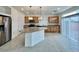 Modern kitchen with granite countertops, stainless steel appliances, an island, and stylish pendant lighting at 5709 Woodchester Ave, Las Vegas, NV 89139