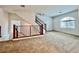 Spacious living room showcasing staircase, modern railings and bright natural light at 5709 Woodchester Ave, Las Vegas, NV 89139