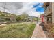 Lush backyard with a well-maintained lawn, established trees, and a gazebo at 5879 Sky Heights Ct, Las Vegas, NV 89135
