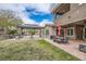 Large backyard featuring patio, gazebo, seating, and manicured lawn at 5879 Sky Heights Ct, Las Vegas, NV 89135
