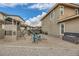 Backyard with playset, trampoline and gravel groundcover at 5879 Sky Heights Ct, Las Vegas, NV 89135