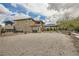 Expansive backyard area with gravel, landscaping, play structure, and gazebo at 5879 Sky Heights Ct, Las Vegas, NV 89135