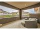 Private balcony featuring a comfortable lounge area with mountain views at 5879 Sky Heights Ct, Las Vegas, NV 89135