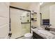 Bathroom with glass shower and granite countertop at 5879 Sky Heights Ct, Las Vegas, NV 89135