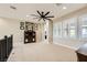 Bonus room featuring neutral walls, carpet, built-in cabinet, and ceiling fan at 5879 Sky Heights Ct, Las Vegas, NV 89135