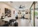 Entertainment room with stylish decor, a ceiling fan, exercise equipment, and a sliding glass door at 5879 Sky Heights Ct, Las Vegas, NV 89135