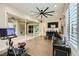 Bonus room with sliding glass doors to patio, exercise equipment, and a television on the wall at 5879 Sky Heights Ct, Las Vegas, NV 89135