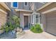 A welcoming entrance features stone accents, pavers, desert landscaping and a cozy, covered entry at 5879 Sky Heights Ct, Las Vegas, NV 89135