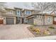 Attractive two-story house featuring two-car garage, stone accents, desert landscaping and a brick driveway at 5879 Sky Heights Ct, Las Vegas, NV 89135