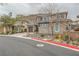 Charming two-story house with a two-car garage, complemented by desert landscaping at 5879 Sky Heights Ct, Las Vegas, NV 89135