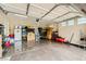 Organized garage featuring epoxy floors, storage solutions, and ample lighting at 5879 Sky Heights Ct, Las Vegas, NV 89135