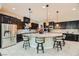 Spacious kitchen boasts a large island with bar seating, stainless steel appliances, and ample cabinet space at 5879 Sky Heights Ct, Las Vegas, NV 89135