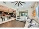 Bright living room with vaulted ceilings, oversized ceiling fan, and elegant décor; ideal for relaxation at 5879 Sky Heights Ct, Las Vegas, NV 89135
