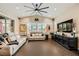 Bright living room with vaulted ceilings, oversized ceiling fan, and elegant décor; ideal for relaxation at 5879 Sky Heights Ct, Las Vegas, NV 89135