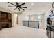 Spacious loft area with a ceiling fan, railing, and natural light from surrounding windows at 5879 Sky Heights Ct, Las Vegas, NV 89135