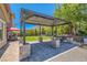 Outdoor pergola with a covered seating area, perfect for entertaining guests or relaxing in the shade at 5879 Sky Heights Ct, Las Vegas, NV 89135