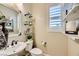 Charming powder room with floating shelves, decorative mirror, and a modern sink at 5879 Sky Heights Ct, Las Vegas, NV 89135