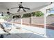 Covered back porch featuring ceiling fans, seating, and a view of the backyard at 6101 Browning Way, Las Vegas, NV 89130