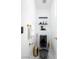 Modern powder room featuring unique black toilet, gold fixtures, and marble floors at 6101 Browning Way, Las Vegas, NV 89130