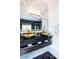 Luxurious bathroom featuring double vessel sinks, marble accents, and a glass enclosed shower at 6101 Browning Way, Las Vegas, NV 89130