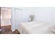 Cozy bedroom showcasing neutral tones, a comfortable bed, and a closet with sliding doors at 6101 Browning Way, Las Vegas, NV 89130