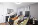 Bedroom with a gray accent wall, mirrored dresser, and mattress covered in items at 6101 Browning Way, Las Vegas, NV 89130