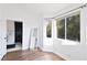 Bright bedroom featuring hardwood floors, a bay window, and an ensuite bathroom at 6101 Browning Way, Las Vegas, NV 89130