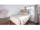 Bright bedroom features stylish furnishings, a decorative headboard, wood floors, and modern decor at 6101 Browning Way, Las Vegas, NV 89130