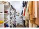Spacious walk-in closet with custom shelving for shoes, handbags, and clothing at 6101 Browning Way, Las Vegas, NV 89130