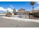 Street view of a home with desert landscaping and a gated entrance at 6101 Browning Way, Las Vegas, NV 89130