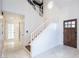 Elegant foyer with high ceilings, staircase, and marble flooring at 6101 Browning Way, Las Vegas, NV 89130