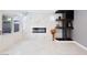 Living room boasts marble floors, a modern fireplace, and a custom built-in bar area at 6101 Browning Way, Las Vegas, NV 89130
