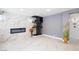 Stylish living room with modern fireplace, wine storage and marble accent wall at 6101 Browning Way, Las Vegas, NV 89130