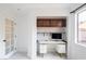 Bright office features a built-in desk, storage cabinets, and plenty of natural light at 6101 Browning Way, Las Vegas, NV 89130