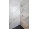 Shower area featuring elegant marble tiling and modern fixtures at 6101 Browning Way, Las Vegas, NV 89130