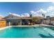 Backyard features a refreshing pool and an outdoor seating area, ideal for relaxation and entertaining guests at 6432 Aberdeen Ln, Las Vegas, NV 89107